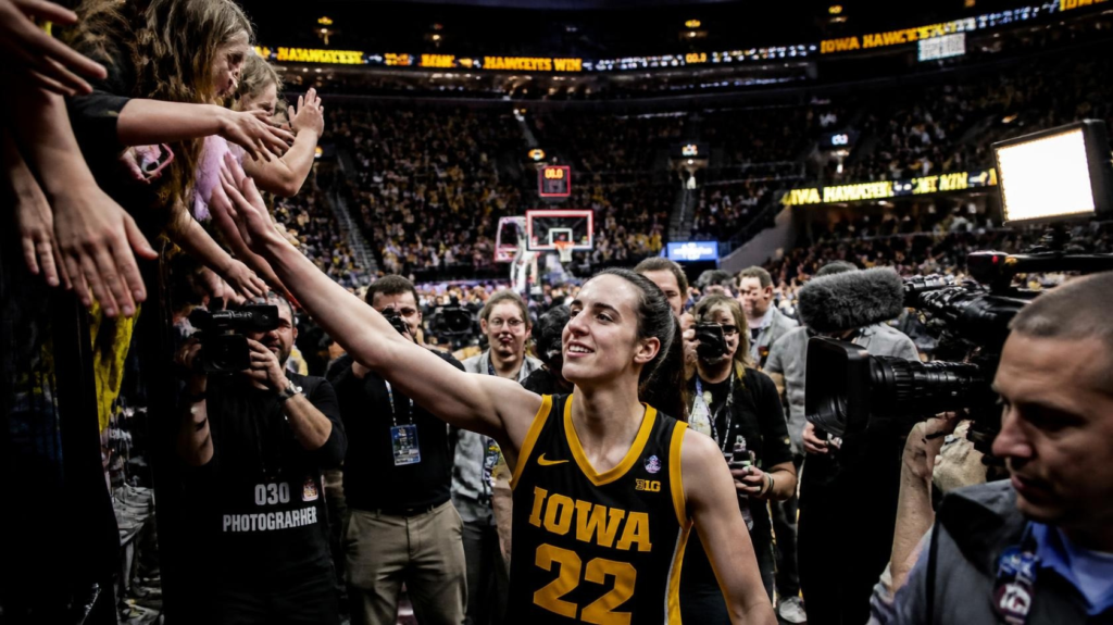 Women's basketball star celebrating with fans after another outstanding WNBA performance.